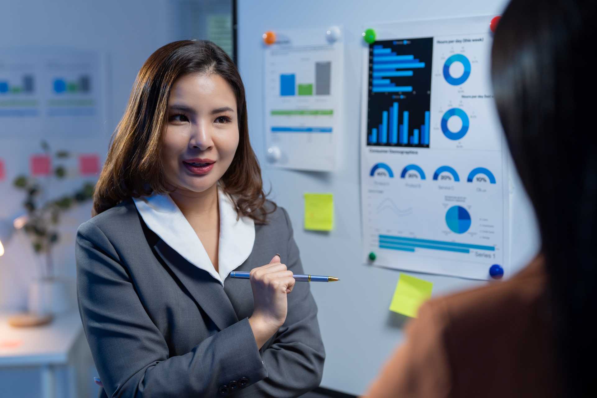 Dynamics Business Central licensing, Two businesswomen are discussing in an office meeting