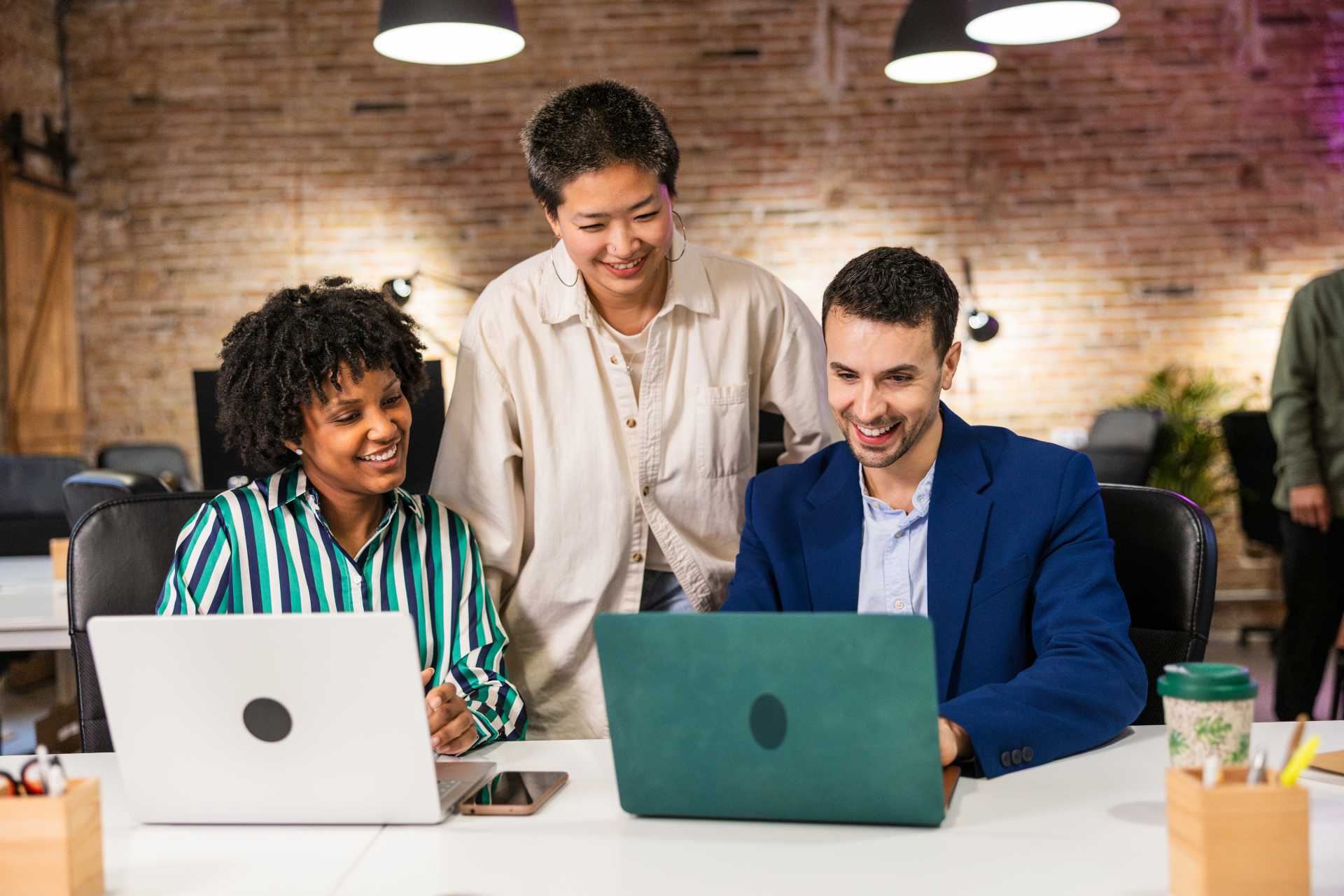 migrating to business central, a team is seen collaborating in an office setup.