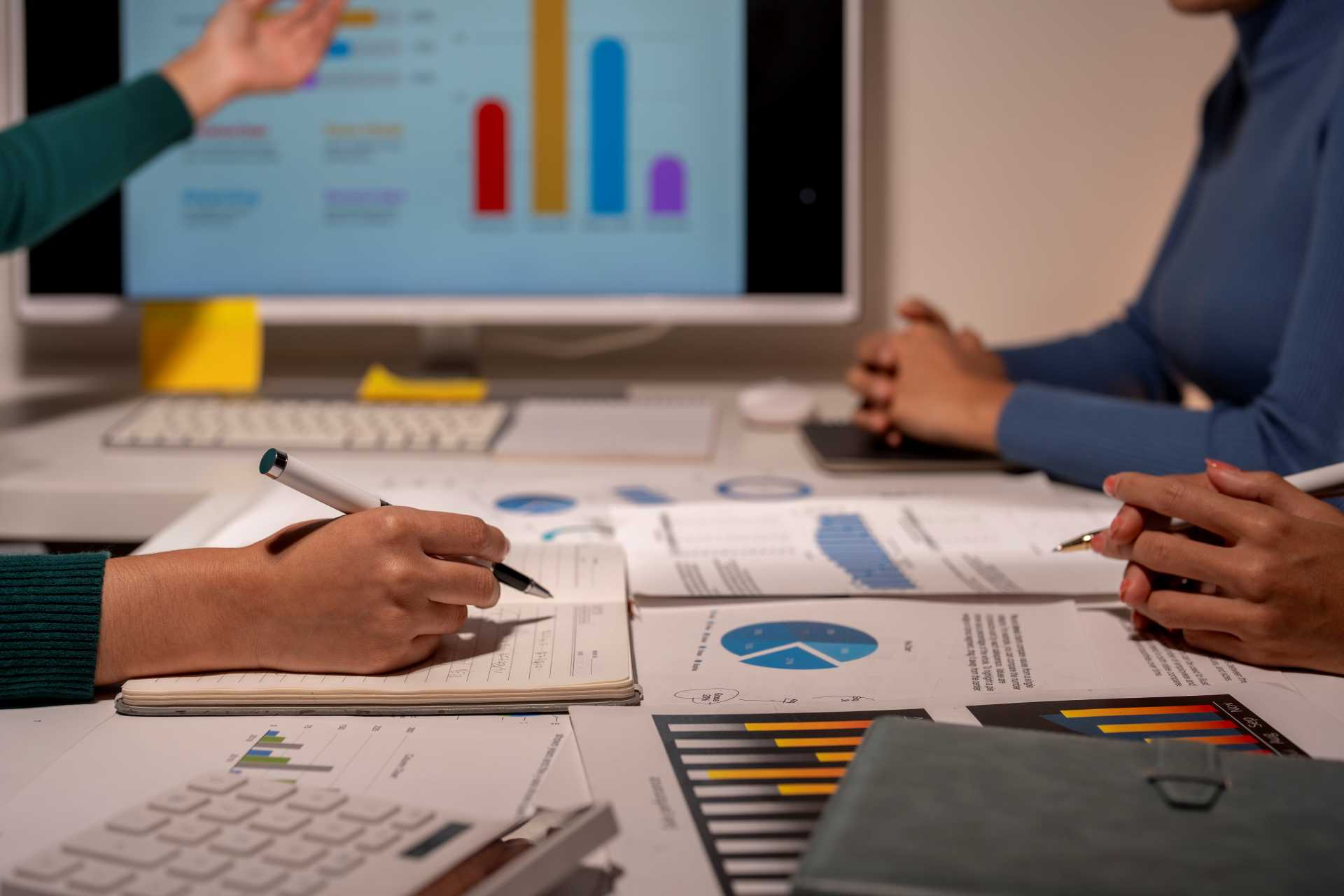 business central reporting issues, a group of people working on business reports.