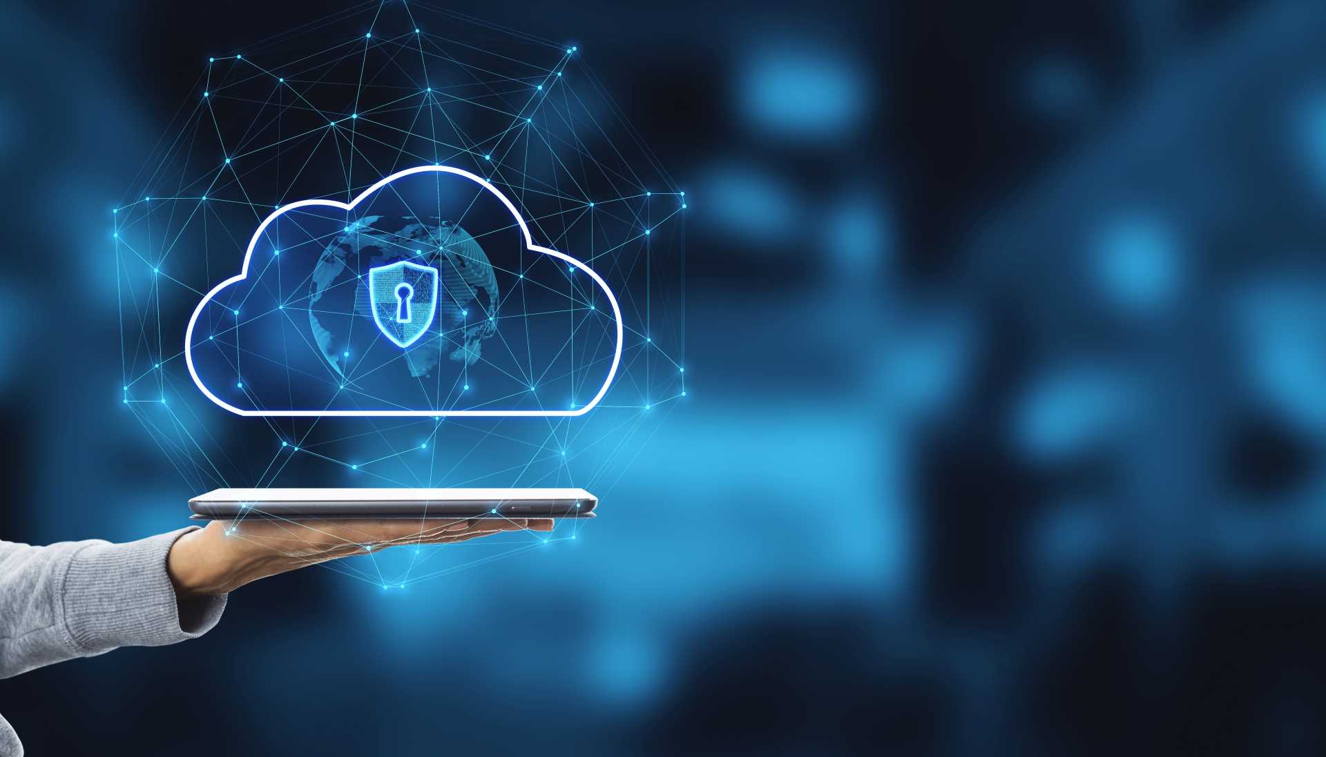 upgrade dynamics NAV 2018 to business central, A close up of a hand holding a tablet with a glowing cloud.