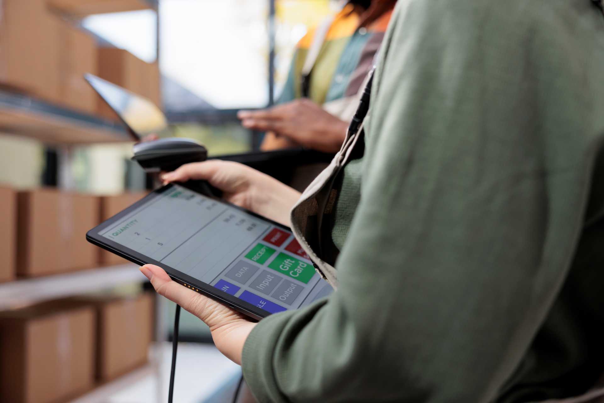 business central e documents, A warehouse worker entering details in an invoicing software