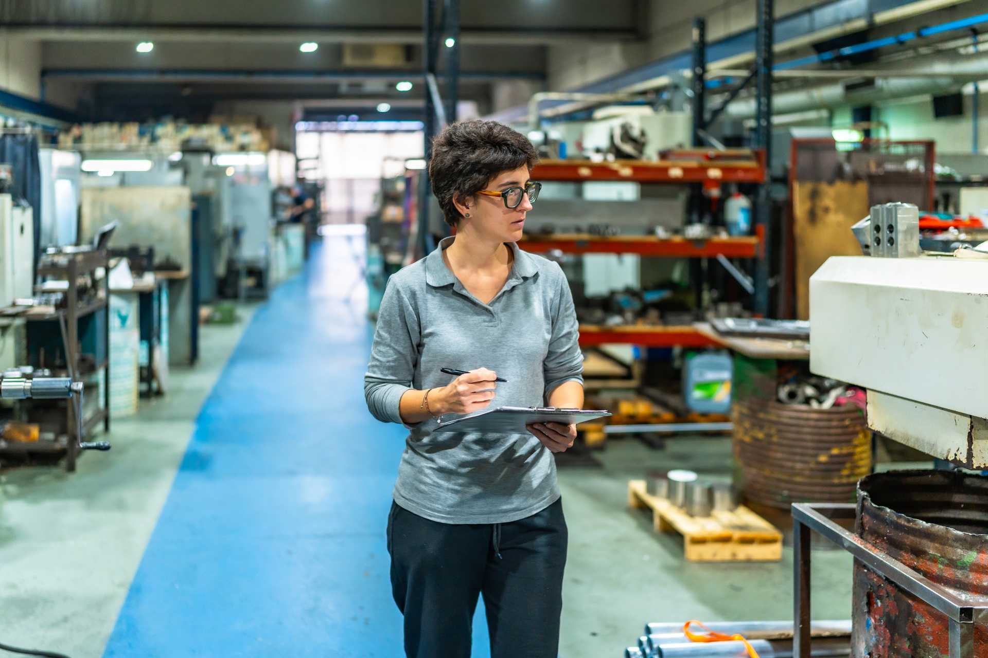 business central manufacturing shop floor control, A shop floor manager of a CNC manufacturing unit during an inspection