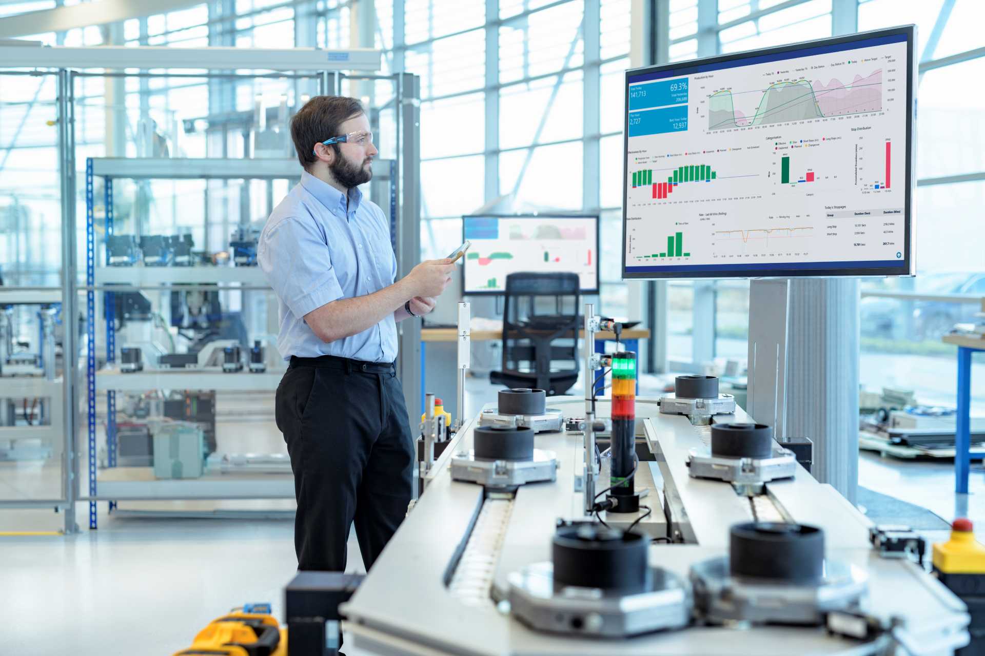 sage 200 alternative, An engineer studying a report on the shop floor.