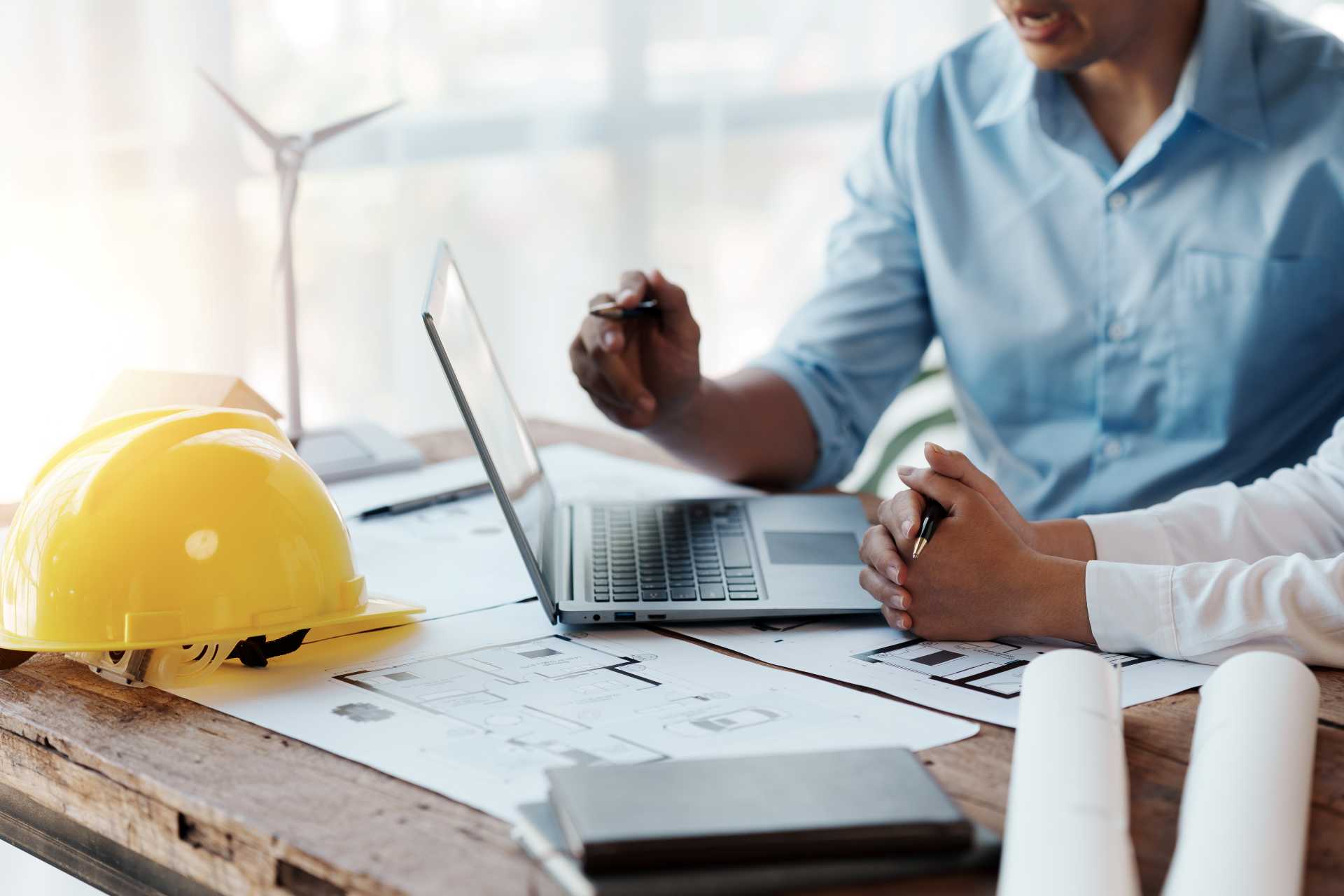 how to choose ERP for construction, A construction team during a meeting